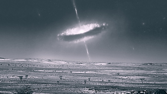 Black hole with jets over a desert landscape
