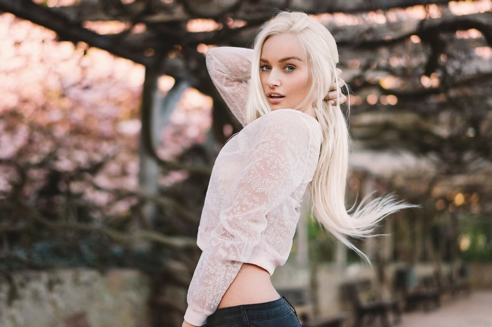 Blonde woman with blue eyes outdoors