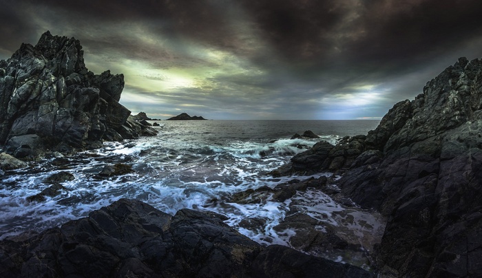 Rocky coast with stormy sea and dramatic sky