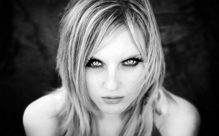 Monochrome portrait of a woman with striking eyes