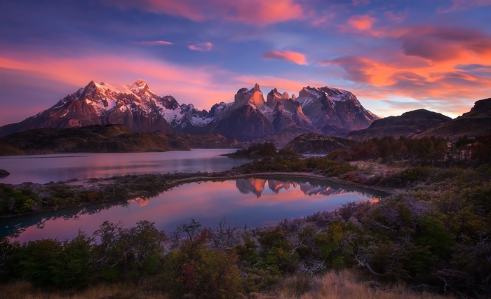 Torres del Paine mountains at sunset with lake reflection