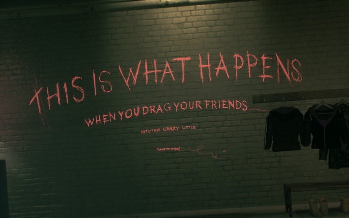 Batman graffiti on a brick wall