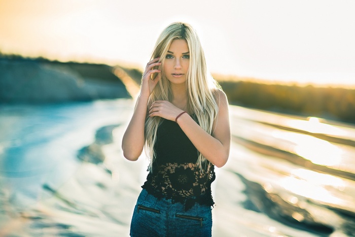 Blonde woman with long hair outdoors