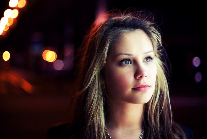 Portrait of a blonde woman with bokeh lights