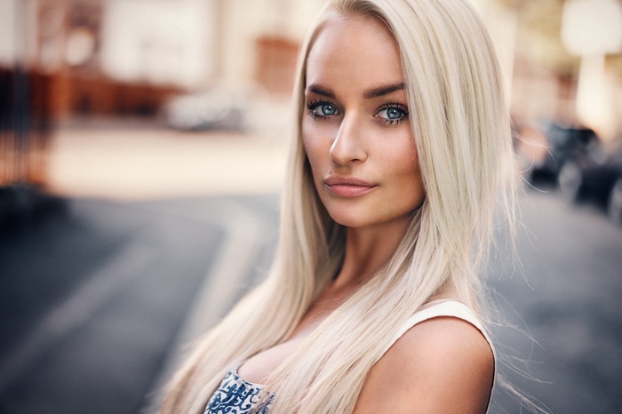 Woman with blonde hair and blue eyes