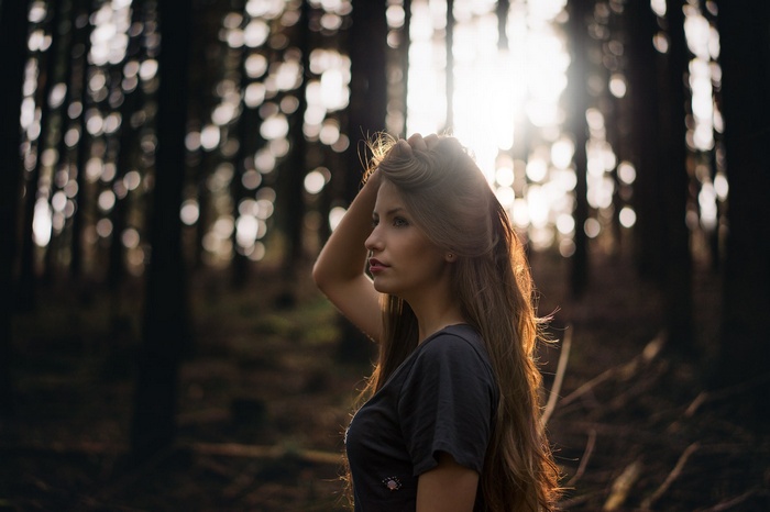 Woman with long hair in a forest