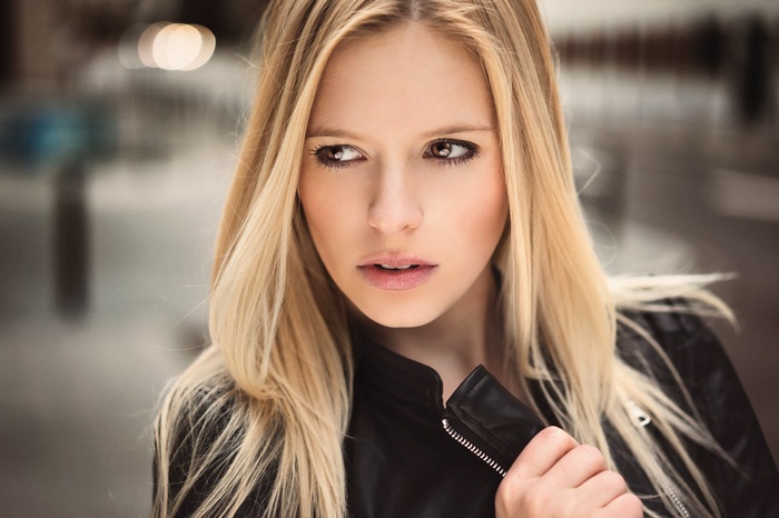 Blonde woman in a black jacket