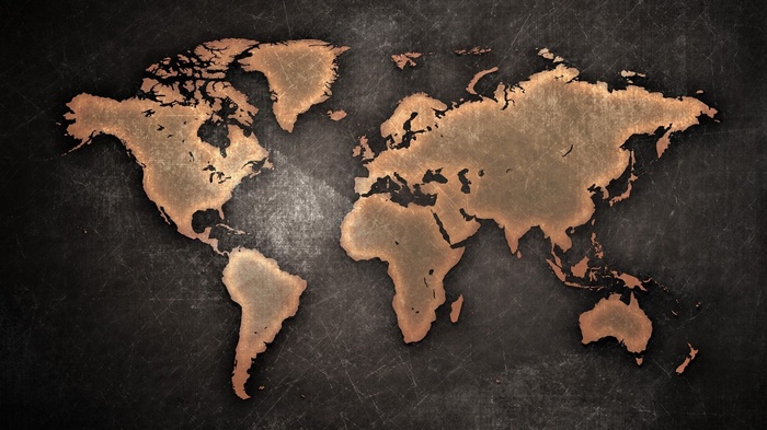 A textured world map with a copper finish
