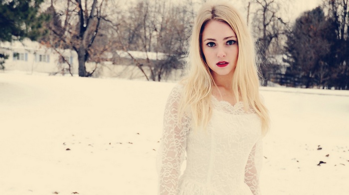 AnnaSophia Robb in a white dress in the snow