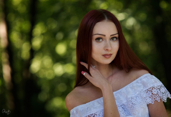 Karina in a white dress outdoors