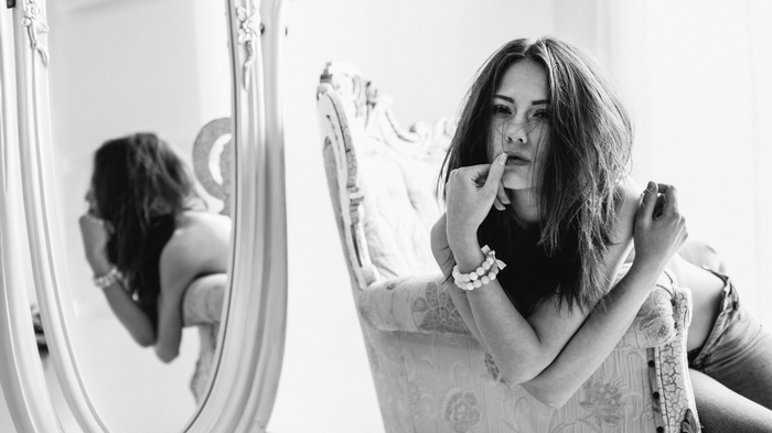 Catherine Timokhina in a chair with a mirror