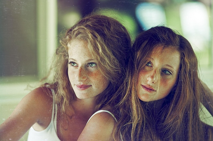 Two young women with freckles