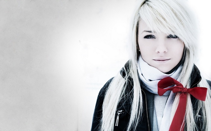Laura Ivana with white hair and red ribbon