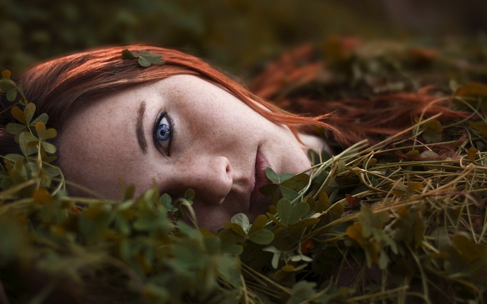 Portrait of a redhead woman with blue eyes