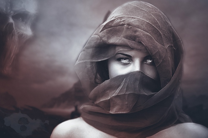 Woman in veil with skull in smoke