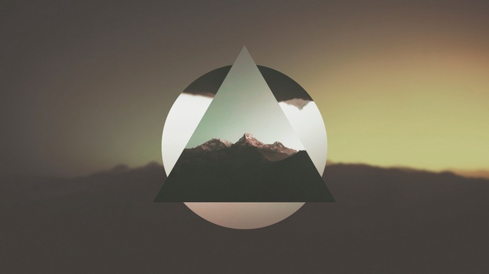 Geometric overlay on mountain landscape at sunset
