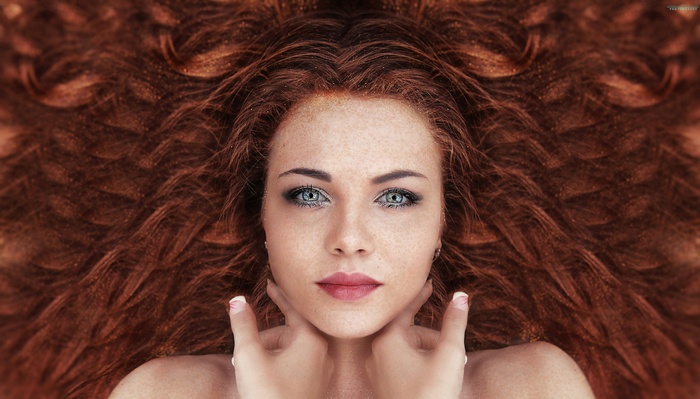 Redhead woman with freckles and blue eyes