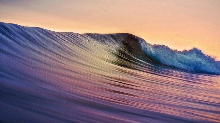 Long exposure of a wave at sunset