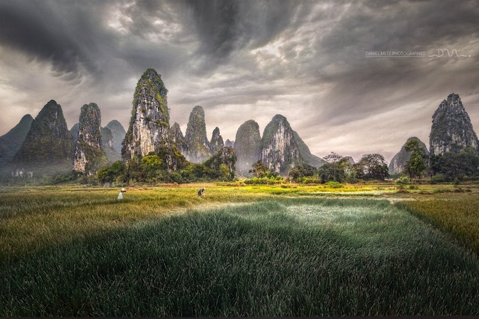 Karst landscape in China with farmers in a field