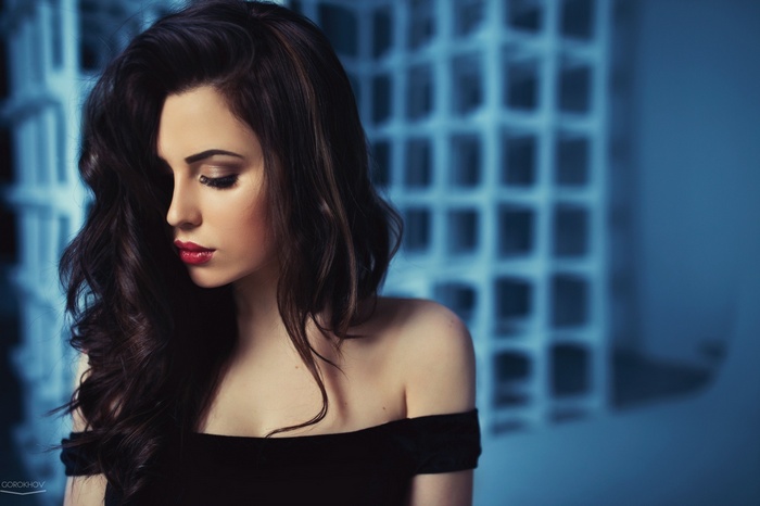 Yulya Pushman in a black dress with red lipstick