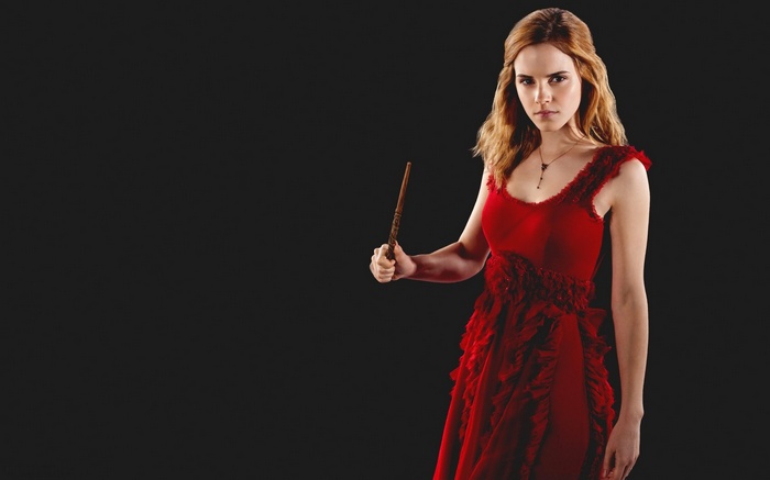 Hermione Granger in a red dress holding a wand