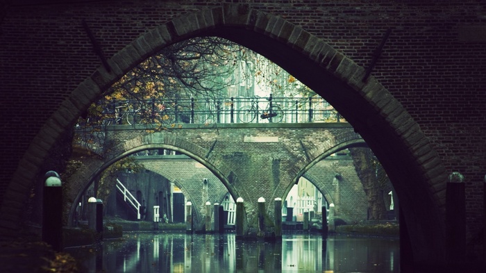 Bicycles on a bridge over a canal in Amsterdam