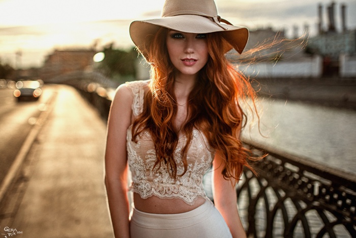 Georgy Chernyadyev with a model wearing a hat