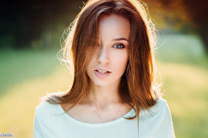 Portrait of a woman with auburn hair by Evgeny Freyer
