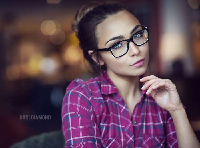 Portrait of a woman with glasses by Dani Diamond