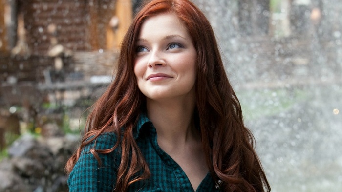Model with long red hair and blue eyes