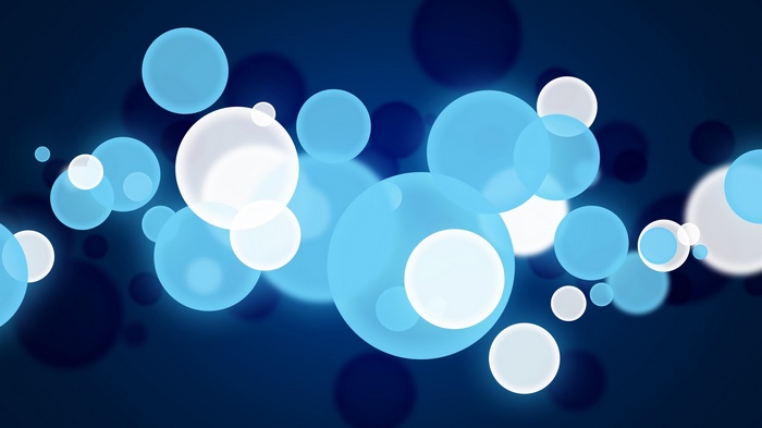 Abstract blue and white bokeh circles on dark background
