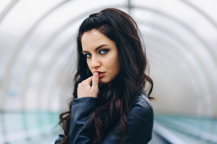 Aurela Skandaj in a leather jacket in a tunnel