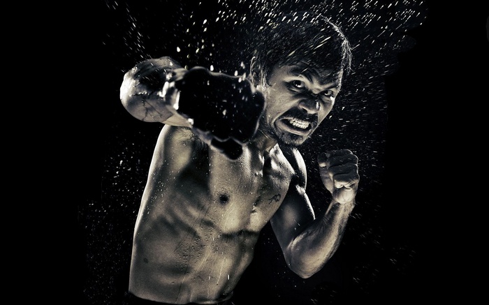 Manny Pacquiao in a boxing pose with water splashes