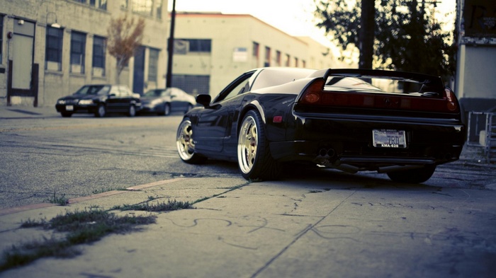 Black Acura NSX parked on a street