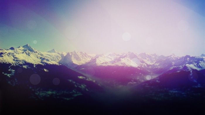 Digital art of snow-capped mountains with sunlight