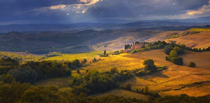 Tuscany landscape with rolling hills and sunlight
