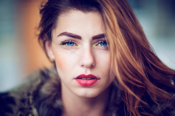 Woman with blue eyes and red lipstick