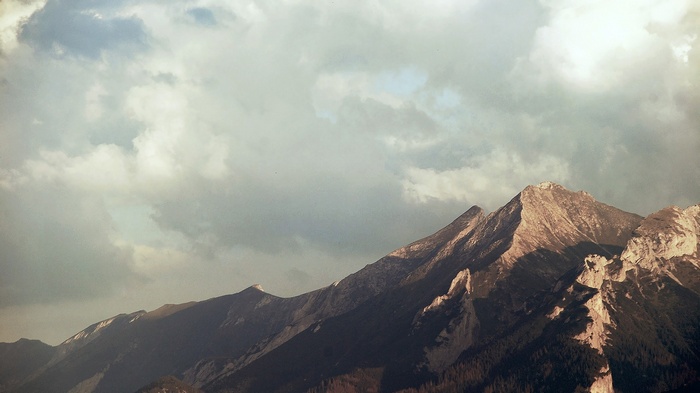 Mountain range under a cloudy sky