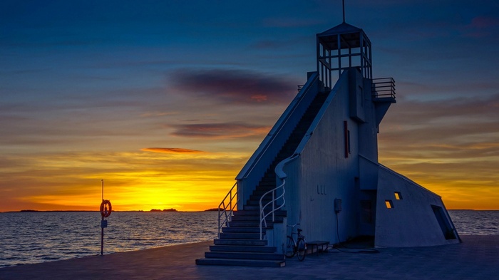 Lighthouse at sunset with ocean view