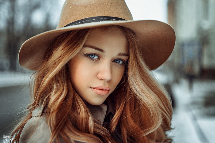 Dasha Romanchenko wearing a hat, looking at viewer