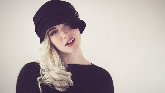 Devon Jade wearing a black hat and sweater