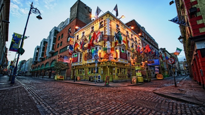 Corner building in Dublin, Ireland, decorated with flags