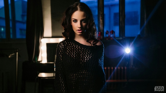 Alla Berger in a black mesh sweater