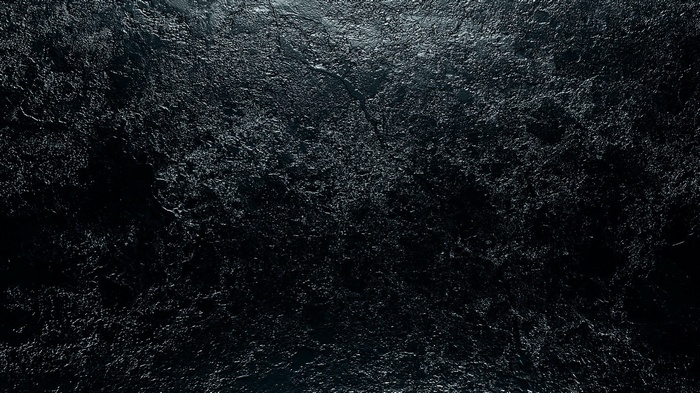 Dark textured surface with light reflections