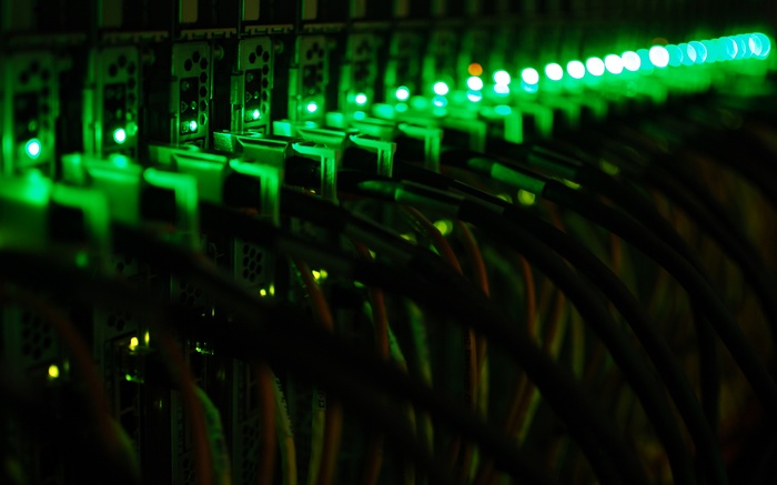 Server rack with green LED lights and cables
