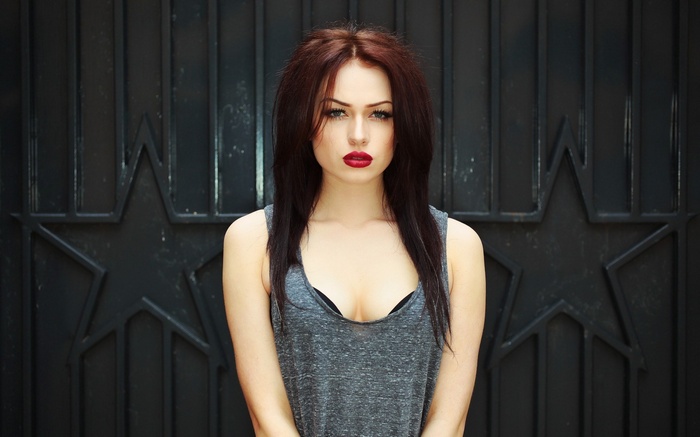 Woman with auburn hair and red lipstick