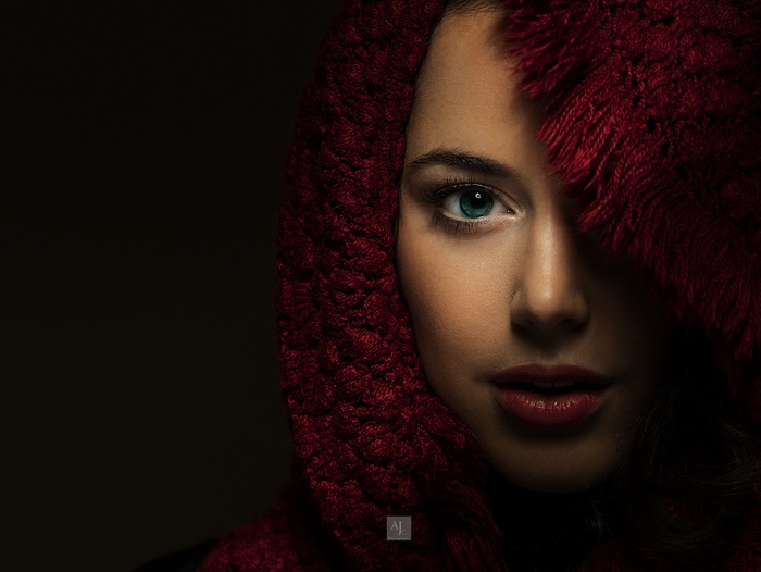 Woman with blue eye and red scarf