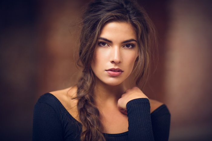 Karina Suntseva with long auburn hair in braids