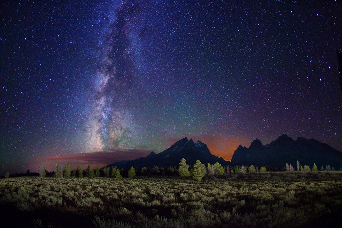 Milky Way over mountains and sagebrush field