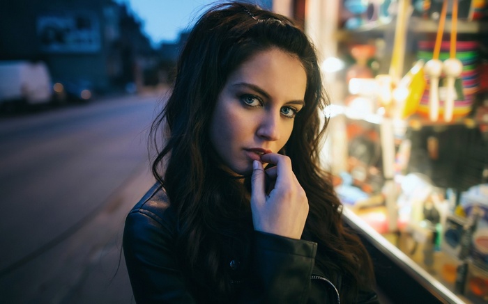 Aurela Skandaj with blue eyes and finger in mouth